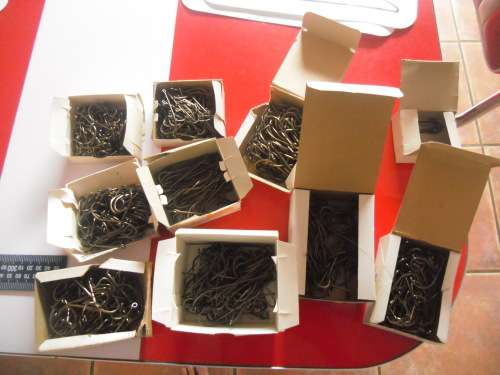 APPROXIMATELY 900 HOOKS (NEVER BEEN USED).